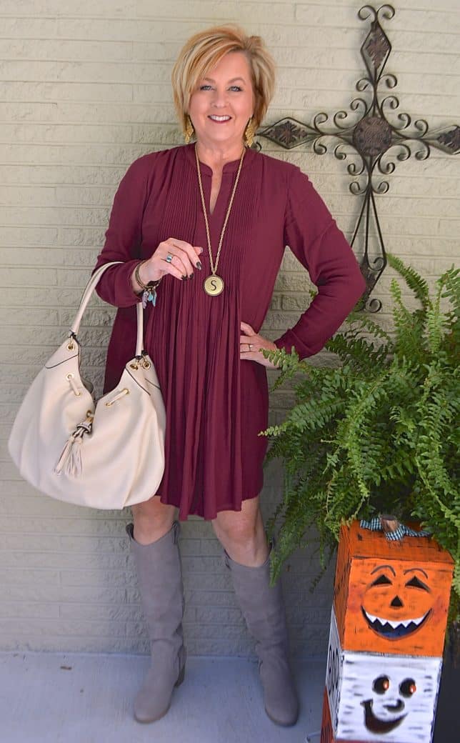 Gray knee boots with a pintucked dress worn by Fashion Blogger 50 Is Not Old