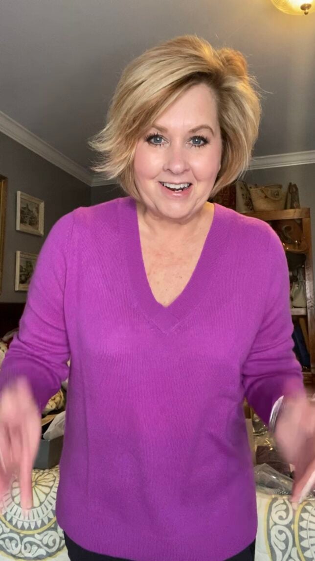 Fashion Blogger 50 Is Not Old holds a try on session with a gorgeous bright purple cashmere sweater