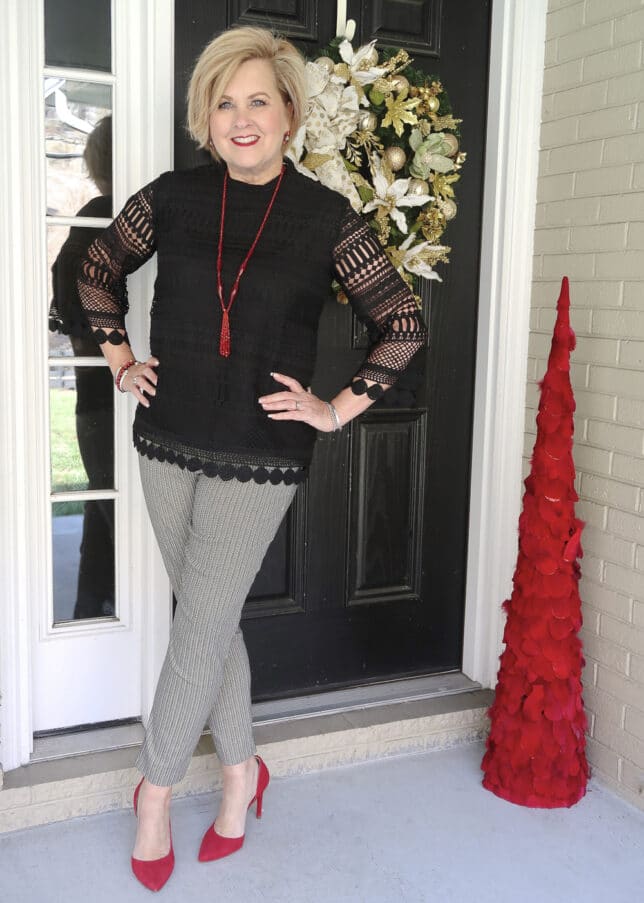Fashion Blogger 50 Is Not Old wearing a black lace top