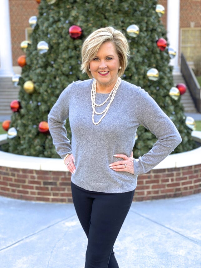 Fashion Blogger 50 Is Not Old wearing a classic gray cashmere sweater and a pearl necklace