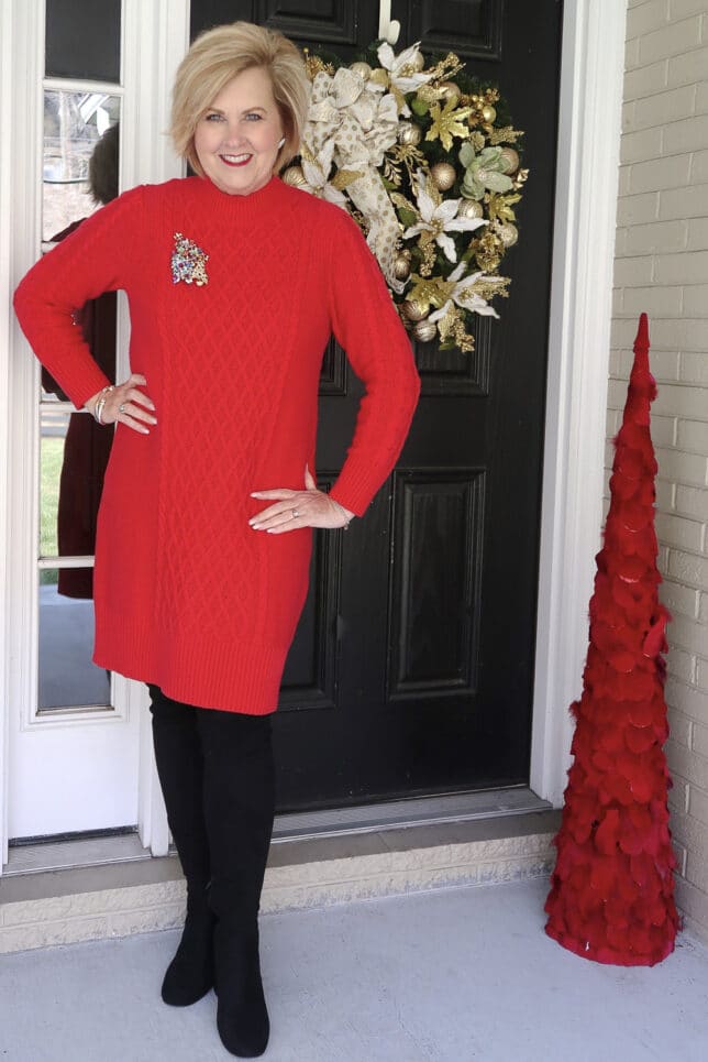 Black over the knee boots with a red sweater dress worn by Fashion Blogger 50 Is Not Old