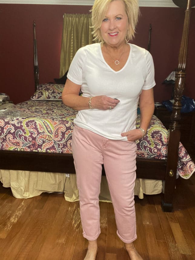 Old Navy try-on haul by Fashion Blogger 50 Is Not Old and she is wearing a white v-neck t-shirt from Target and a pair of pink boyfriend jeans