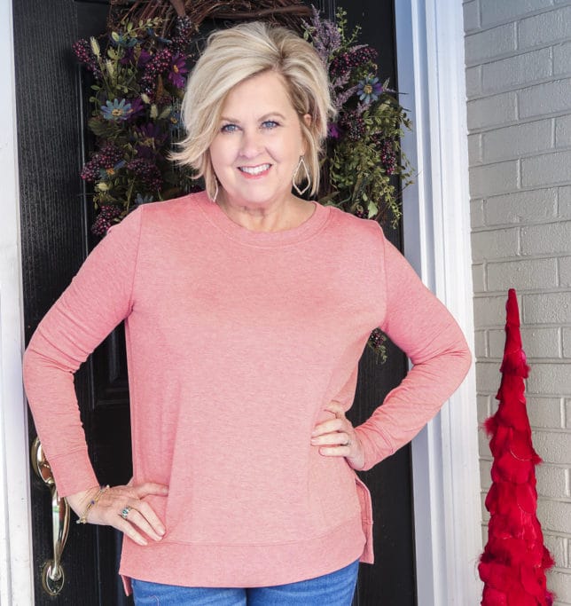 Fashion Blogger 50 Is Not Old is wearing a super soft rose/coral tunic top