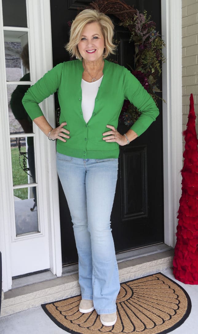 Fashion Blogger 50 Is Not Old is feeling springy with this Kelly Green cardigan from J.Crew Factory and faded flared jeans from Walmart
