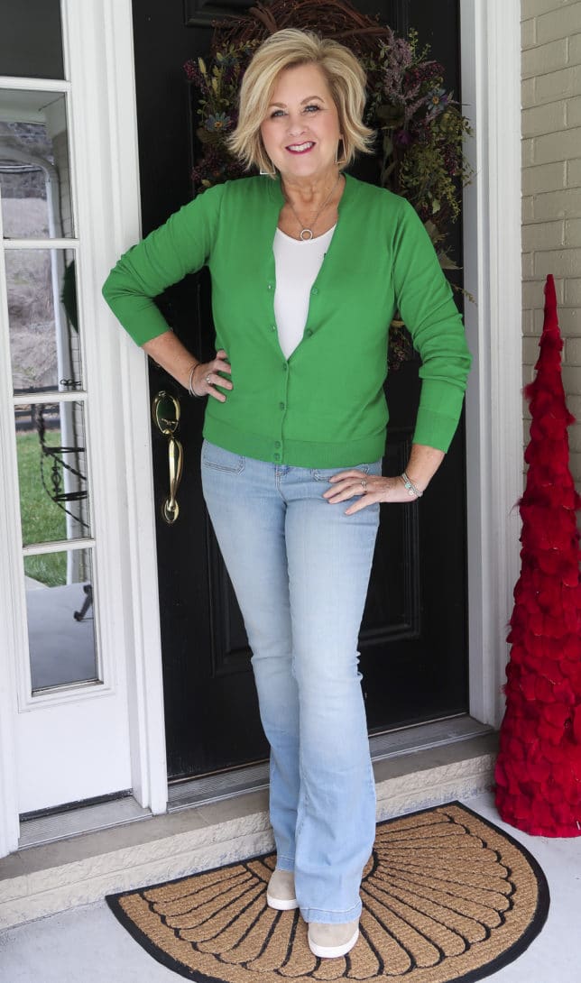 Fashion Blogger 50 Is Not Old is in the mood for spring with this Kelly Green cardigan from J.Crew Factory and faded flared jeans from Walmart