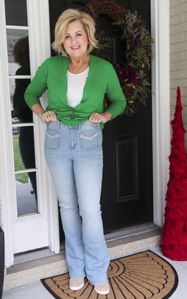Fashion Blogger 50 Is Not Old is wearing a high waisted pair of faded flared jeans from Walmart