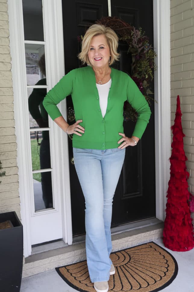 Fashion Blogger 50 Is Not Old is in the mood for spring with this Kelly Green cardigan from J.Crew Factory and flared jeans from Walmart