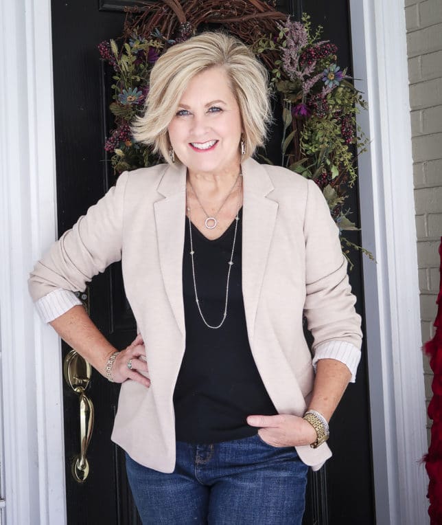 Fashion Blogger 50 Is Not Old wearing a taupe Ponte knit blazer and a black v-neck t-shirt