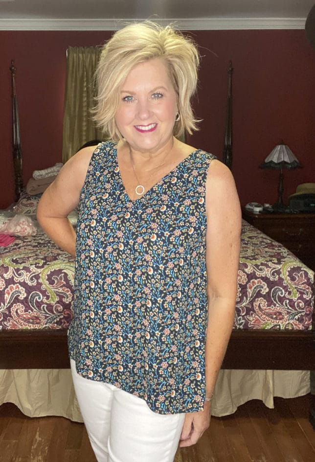 Fashion Blogger 50 Is Not Old is wearing a Spring floral tank top with white skinny jeans from Loft