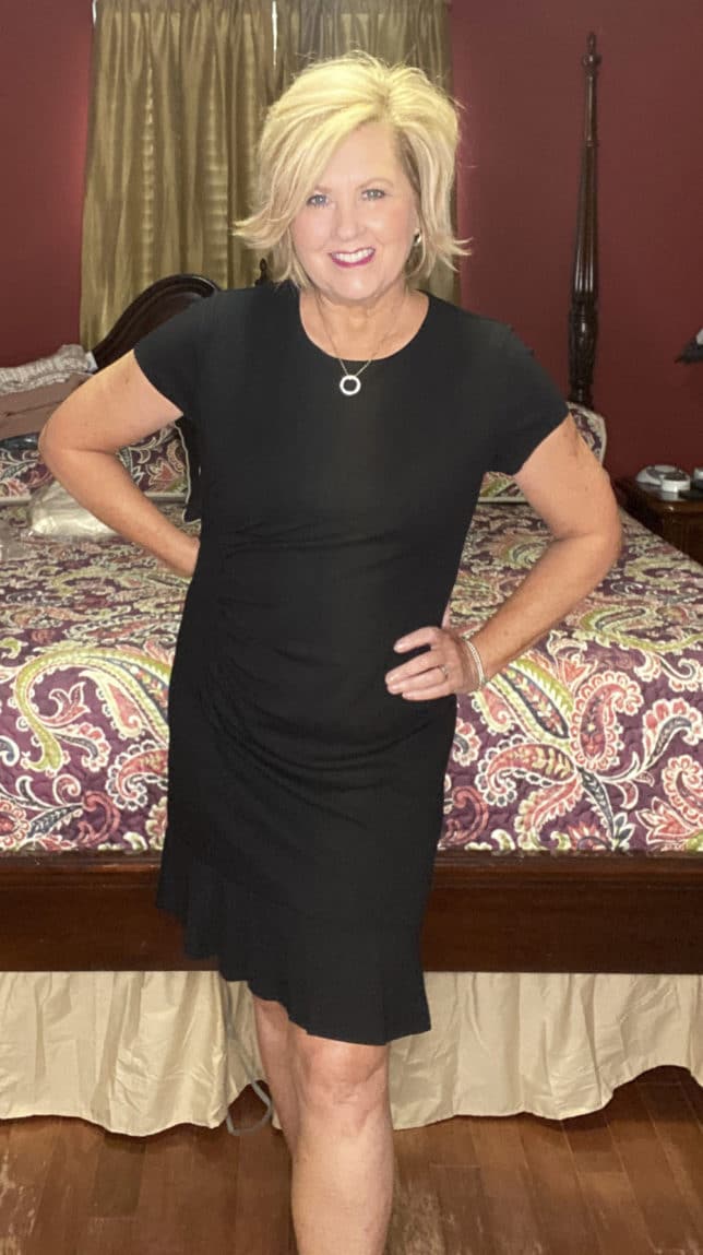 Fashion Blogger 50 Is Not Old is wearing a black ruched dress