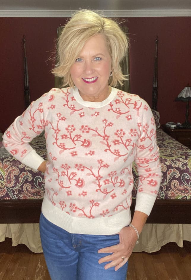 Fashion Blogger 50 Is Not Old is wearing a pink floral sweater 