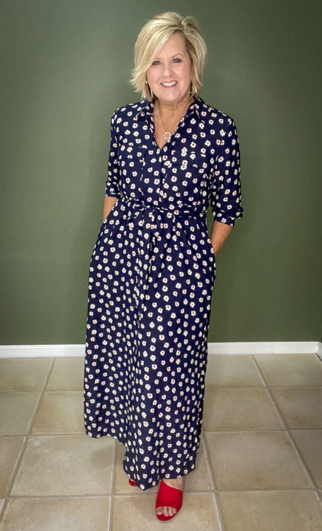 Fashion Blogger 50 Is Not Old wearing a fashionable navy dress with white daisies from Walmart