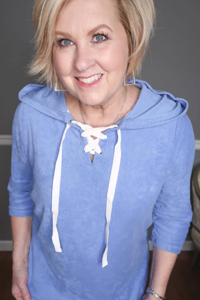 Fashion Blogger 50 Is Not Old is wearing a blue terry lace up top