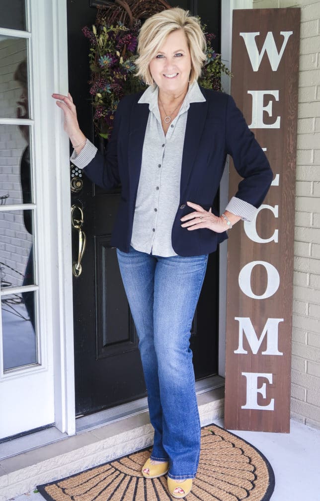 Fashion Blogger 50 Is Not Old wearing a knit button down, a navy blazer, Kut From The Kloth flare jeans, and yellow espadrille shoes