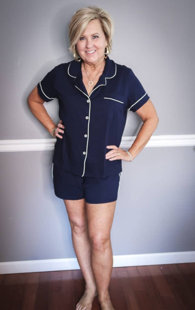 Fashion Blogger 50 Is Not Old wearing a navy button up pajama set