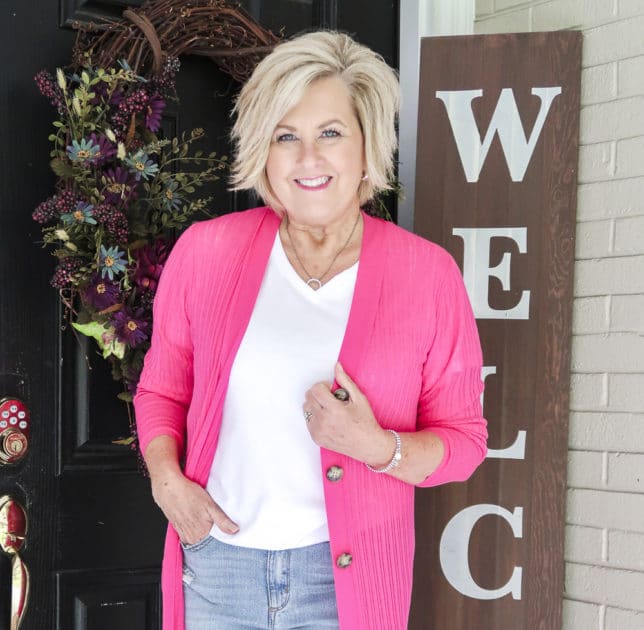 Fashion Blogger 50 Is Not Old is looking colorful with this hot pink duster cardigan and white t-shirt