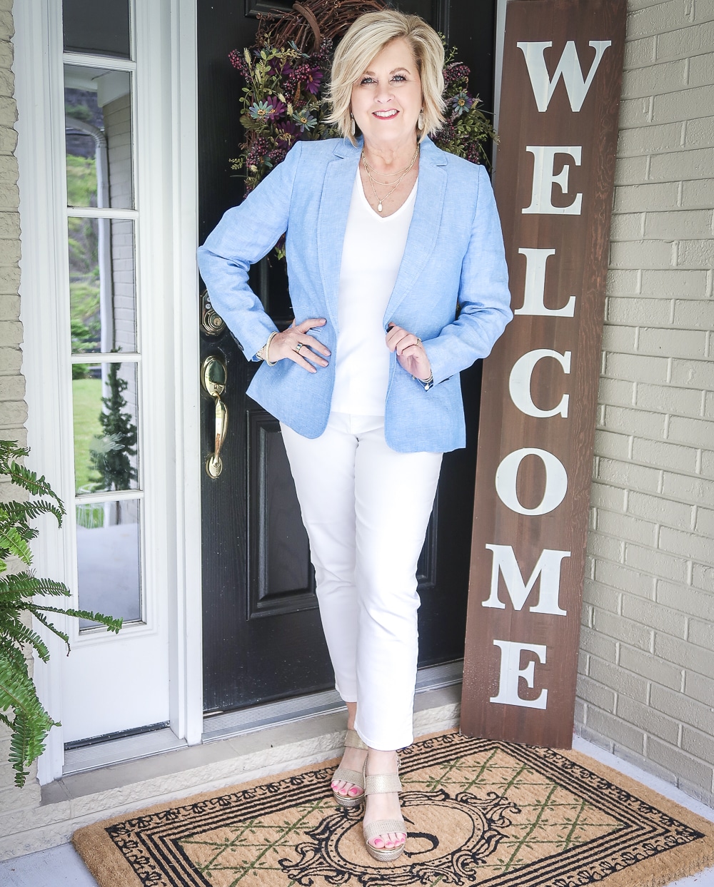 Fashion Blogger 50 Is Not Old is wearing an all white outfit with a blue linen blazer from Talbots and gold espadrilles