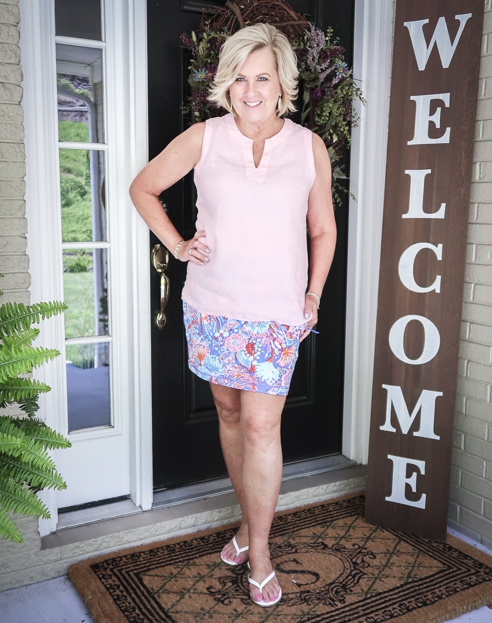Fashion Blogger 50 Is Not Old is wearing a pale linen v neck top with a colorful skort