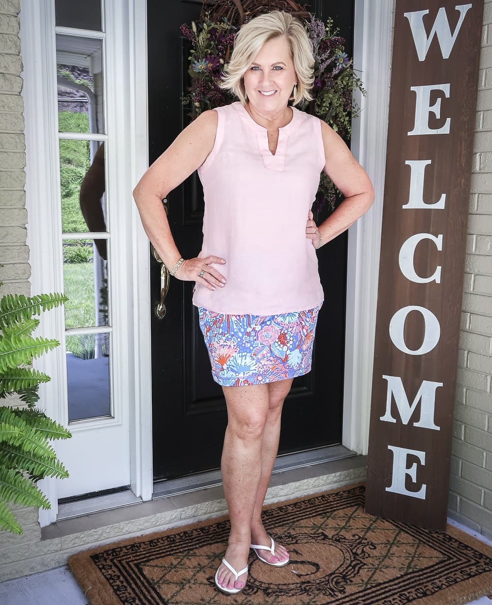 Fashion Blogger 50 Is Not Old is wearing a pale linen v neck top and a colorful skort