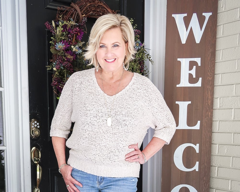 Fashion Blogger 50 Is Not Old is wearing a Sand sweater