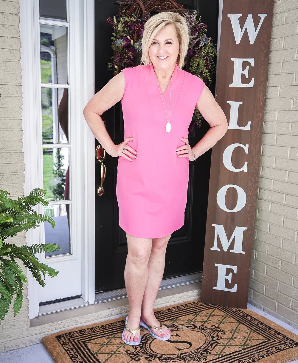 Fashion Blogger 50 Is Not Old is wearing a comfortable pink dress from Isaac Mizrahi with Lilly Pulitzer flip flops