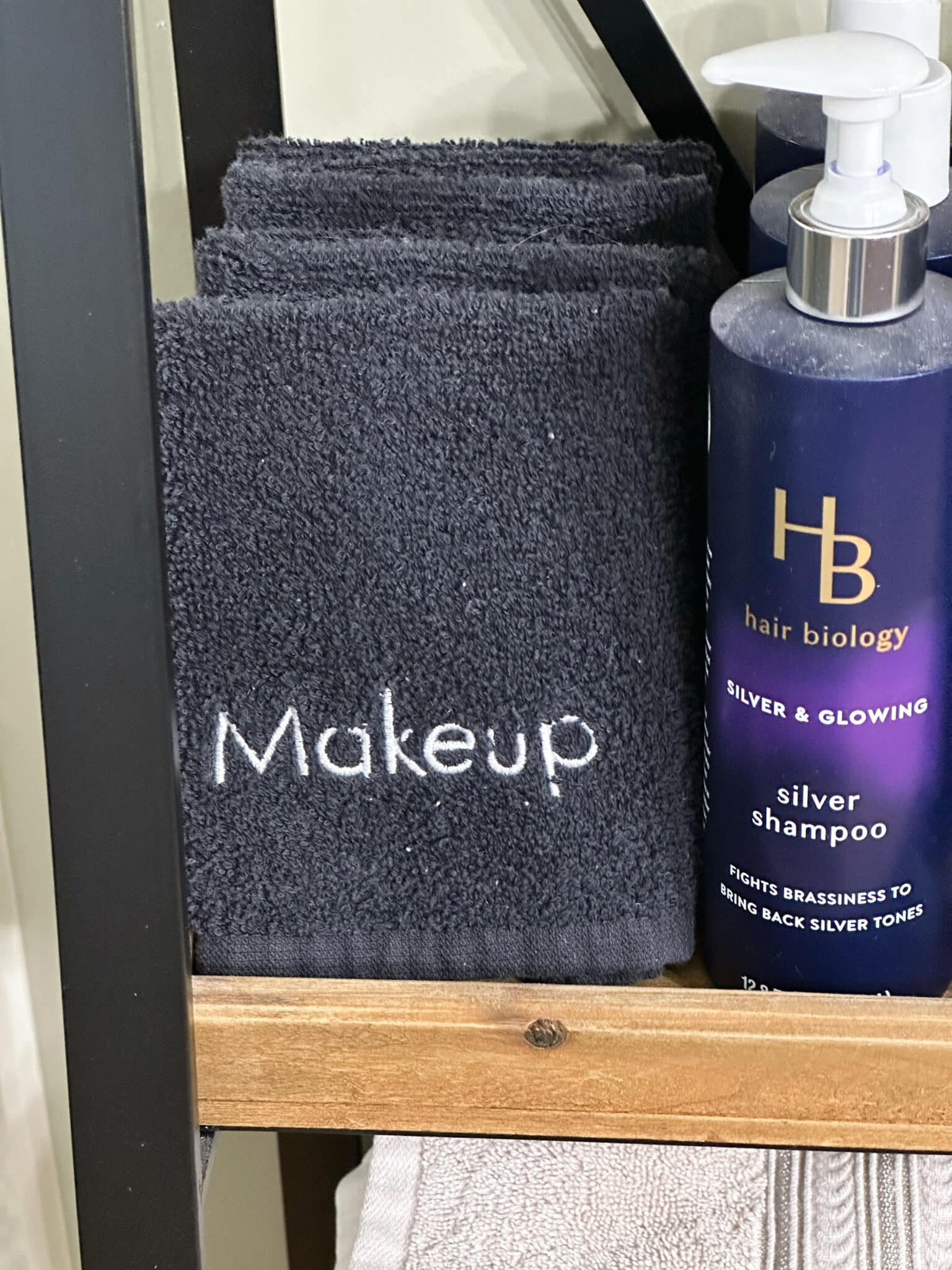 Over 50 Fashion Blogger, Tania Stephens is holding a few of her favorite things, makeup cloths