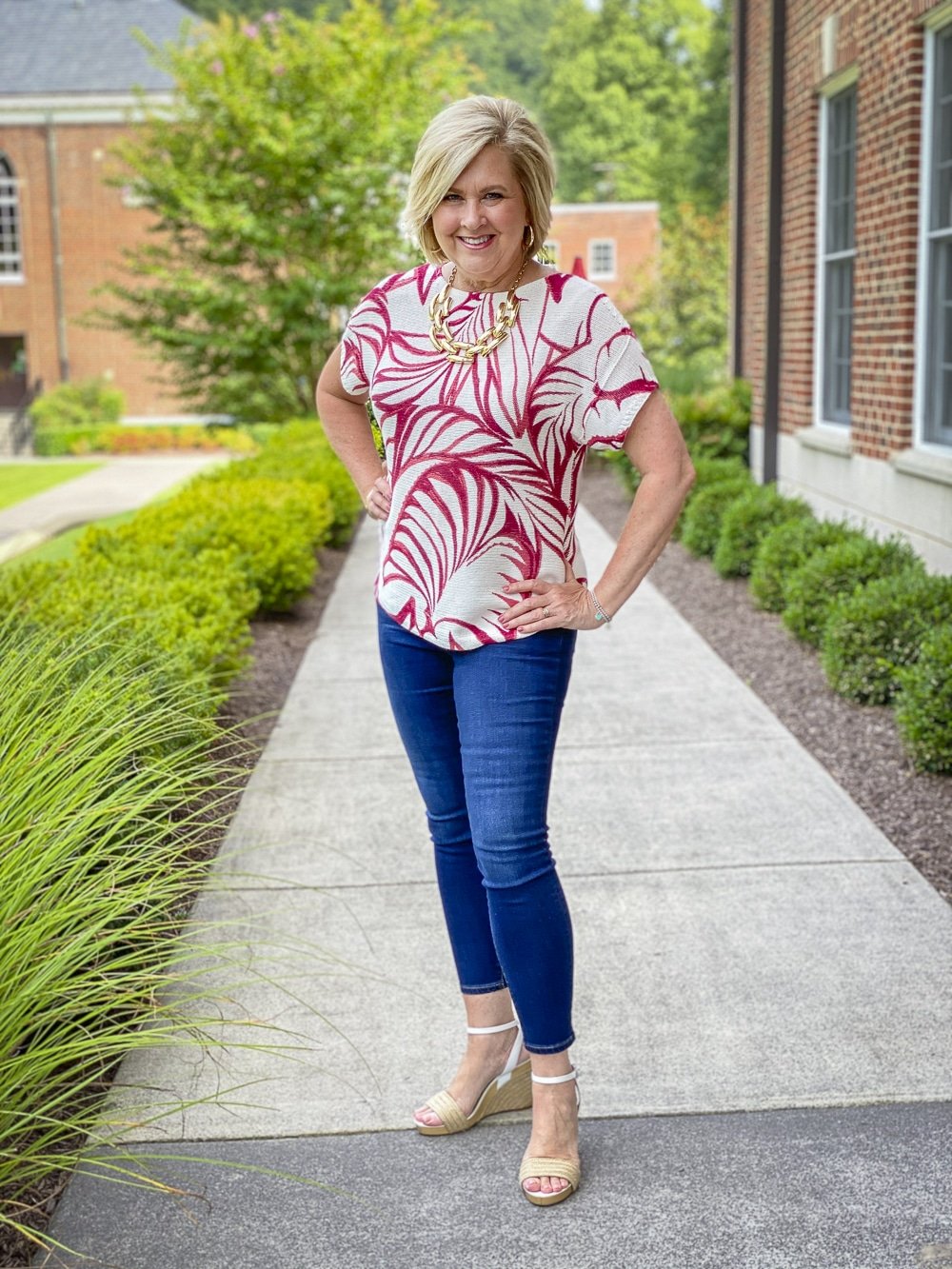 Fashion Blogger 50 Is Not Old is ready for a staycation in her red and white tropical leaf print sweater and skinny ankle jeans from Chico's