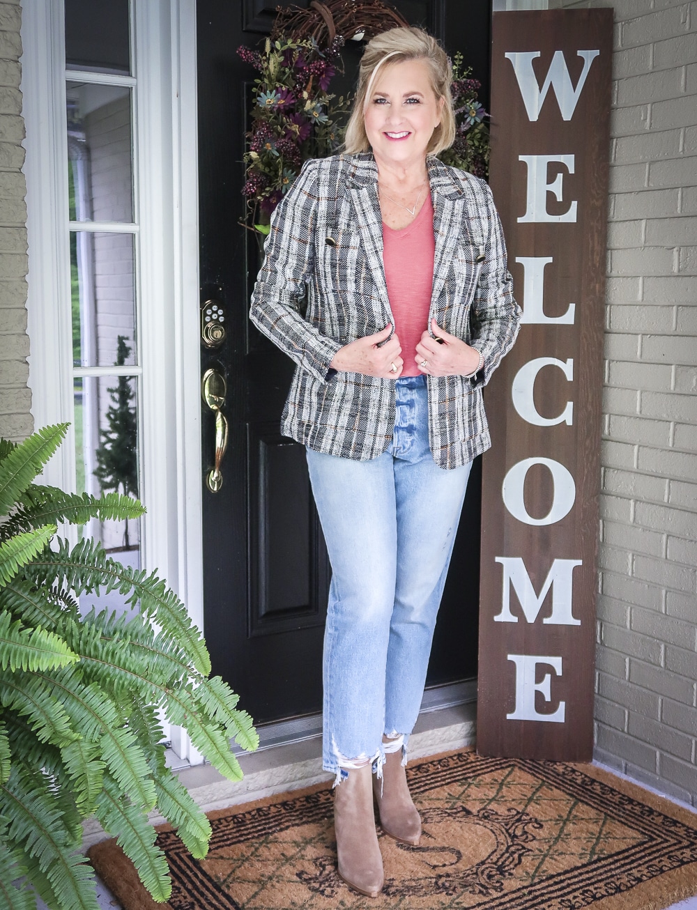 Fashion Blogger 50 Is Not Old is wearing a tweed blazer and distressed jeans