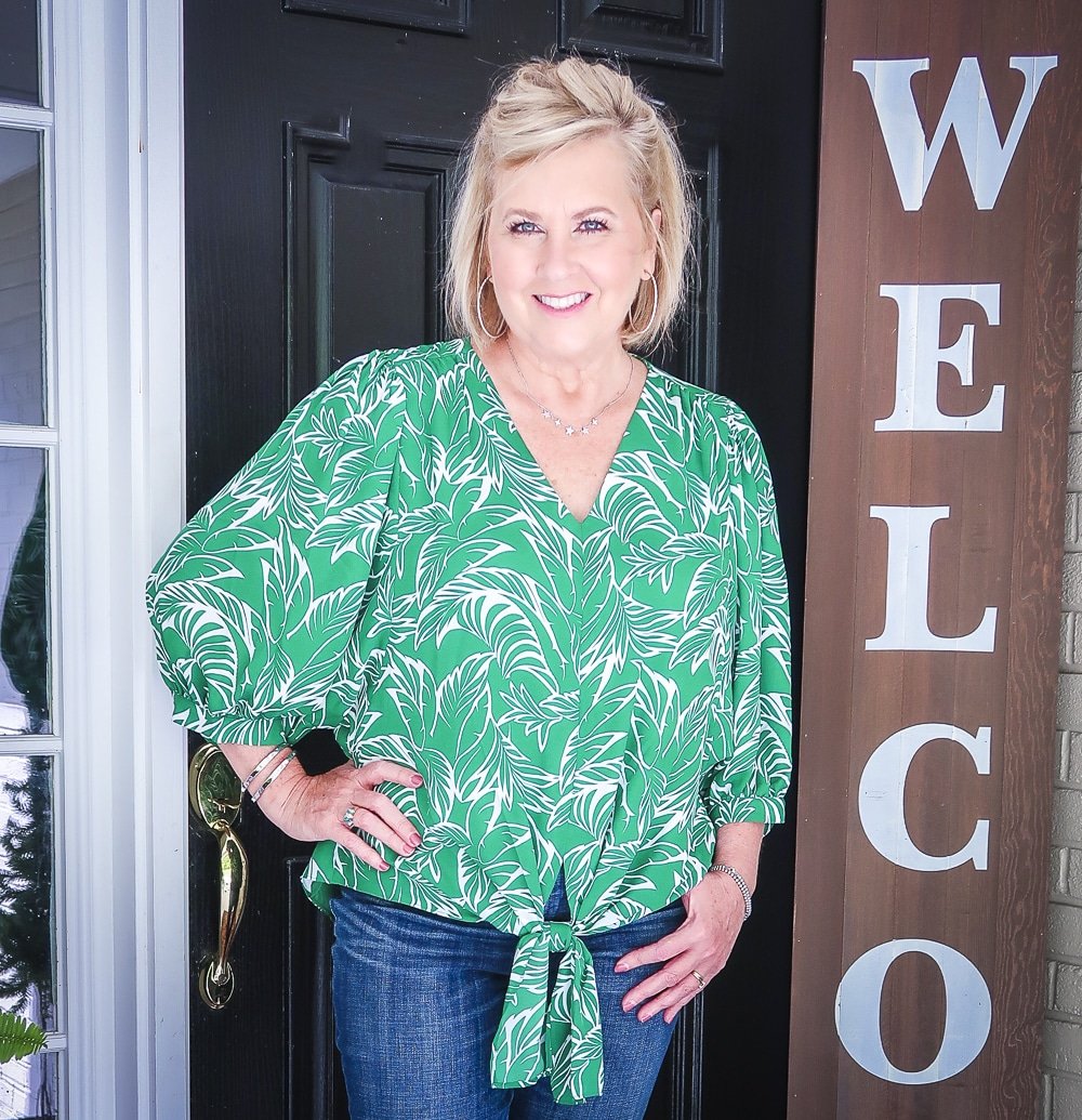 Fashion Blogger 50 Is Not Old is wearing a green palm print top