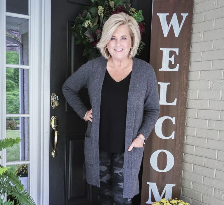 Fashion Blogger 50 Is Not Old is wearing a soft and cozy long gray cardigan with a black v-neck tank top