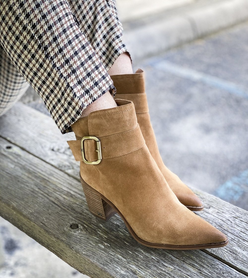 Fashion Blogger 50 Is Not Old is wearing taupe ankle boots with a buckle