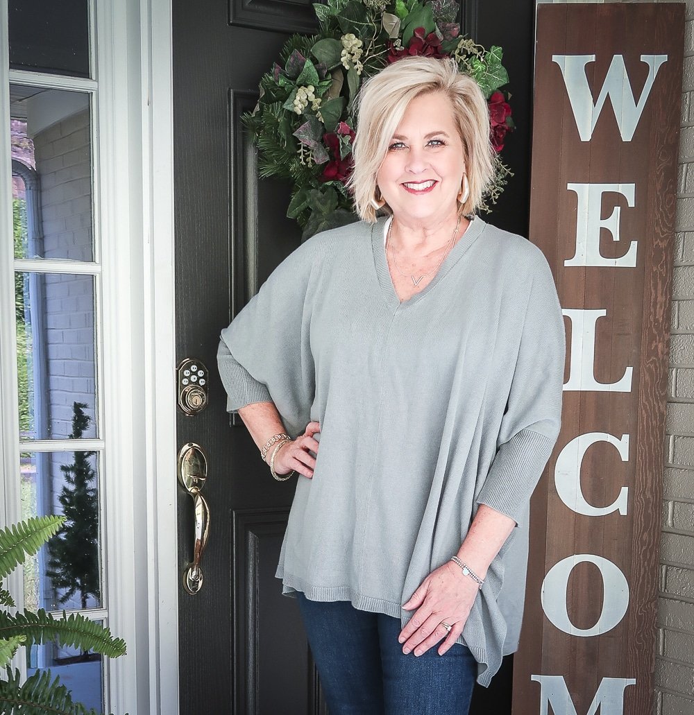 Fashion Blogger 50 Is Not Old is doing a Tuesday Try-On Session with Target and styling a marble green poncho and a white v-neck tee shirt