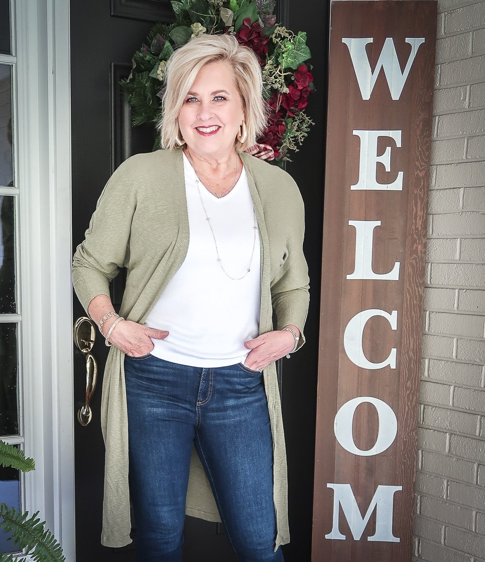 Fashion Blogger 50 Is Not Old is doing a Tuesday Try-On Session with Target and styling a long olive cardigan and a white v-neck tee shirt