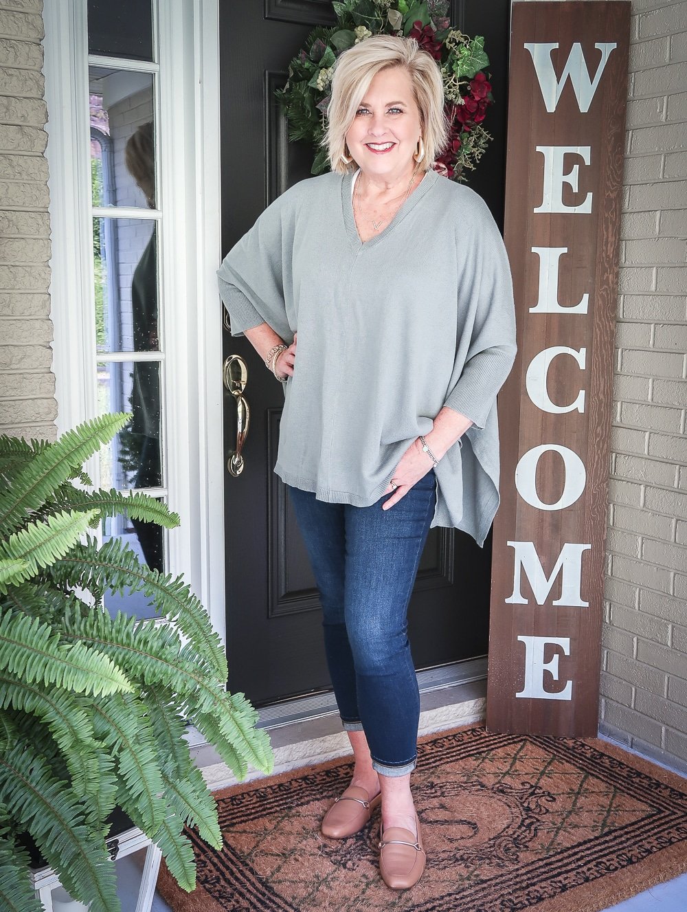 Fashion Blogger 50 Is Not Old is doing a Tuesday Try-On Session with Target and styling a marble green poncho with a white v-neck tee shirt