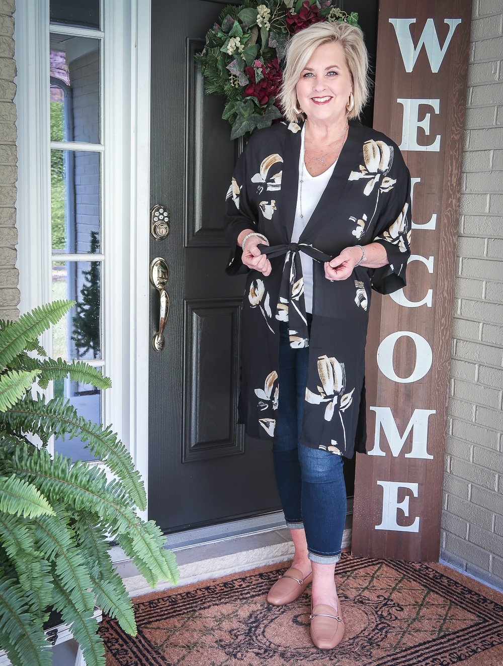 Fashion Blogger 50 Is Not Old is doing a Tuesday Try-On Session with Target and styling a black floral kimono with a white v-neck tee shirt