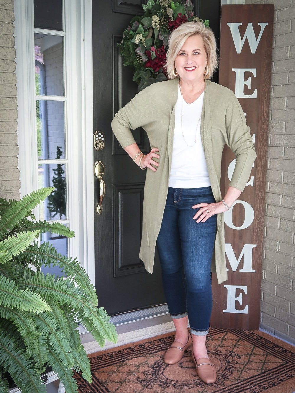 Fashion Blogger 50 Is Not Old is doing a Tuesday Try-On Session with Target and styling a long olive cardigan with a white v-neck tee shirt