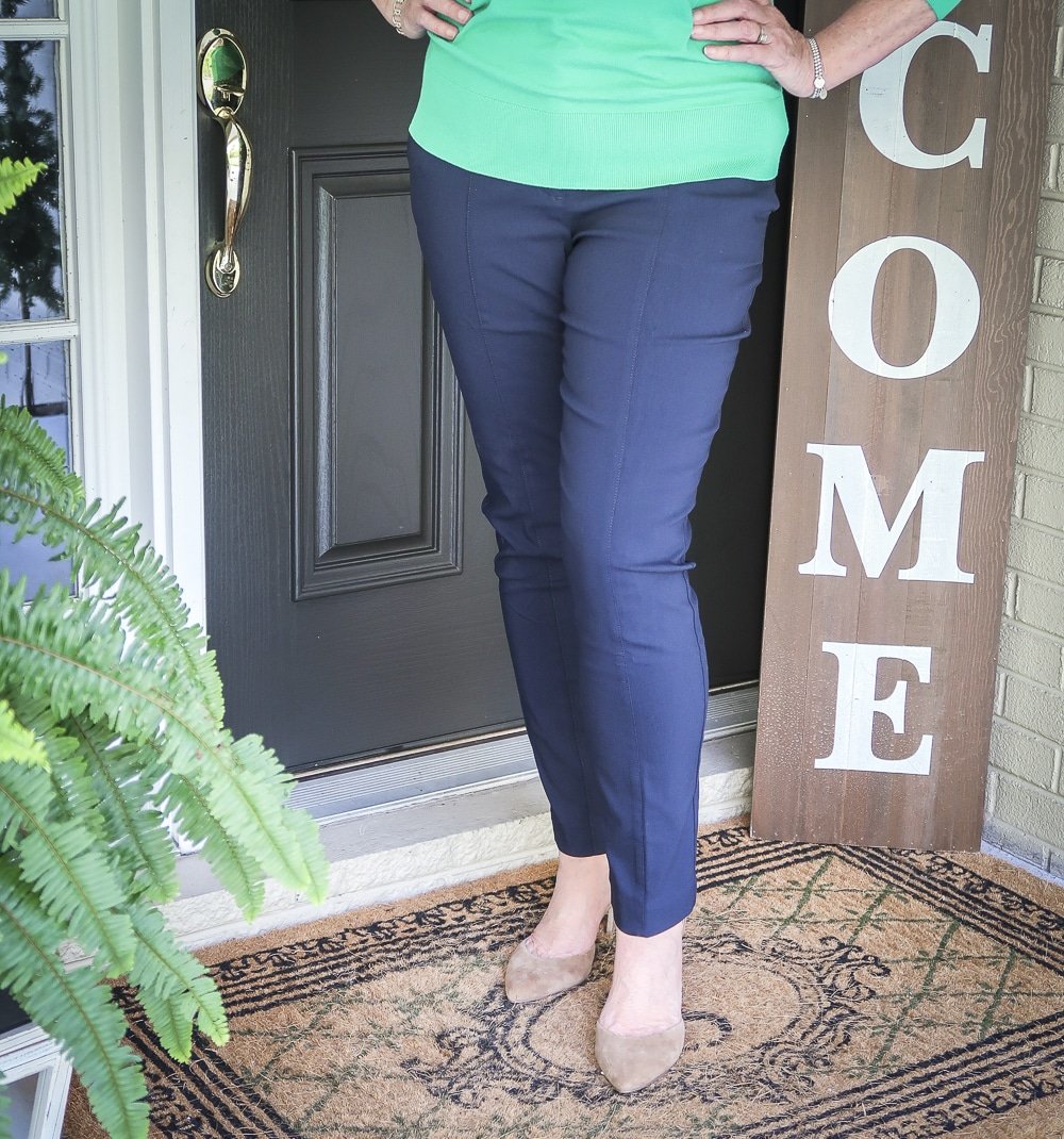 Fashion Blogger 50 Is Not Old is wearing a navy pants and neutral colored heels