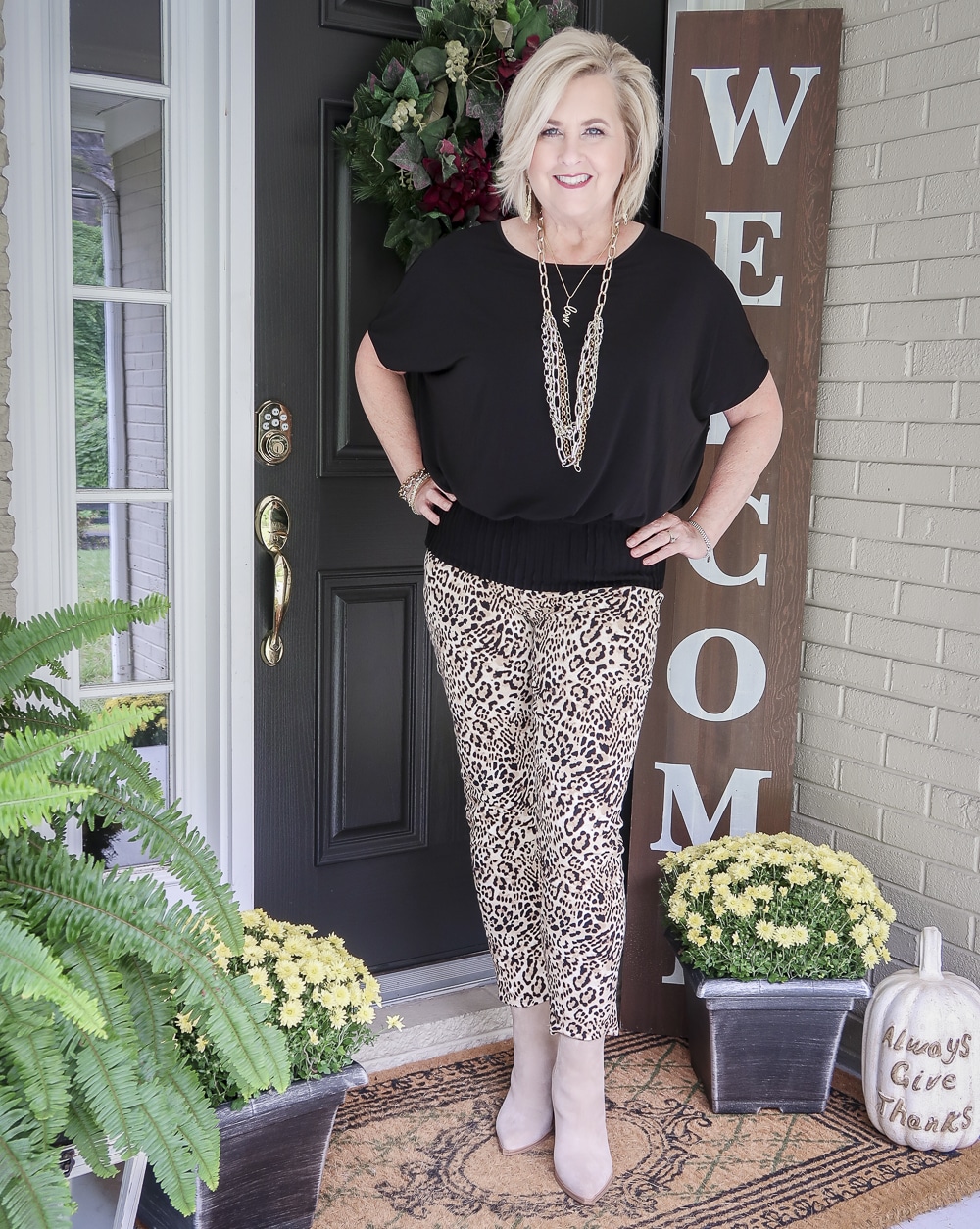 Fashion Blogger 50 Is Not Old is over 40 and still looks fabulous in this black top and cheetah print jeans from Chicos