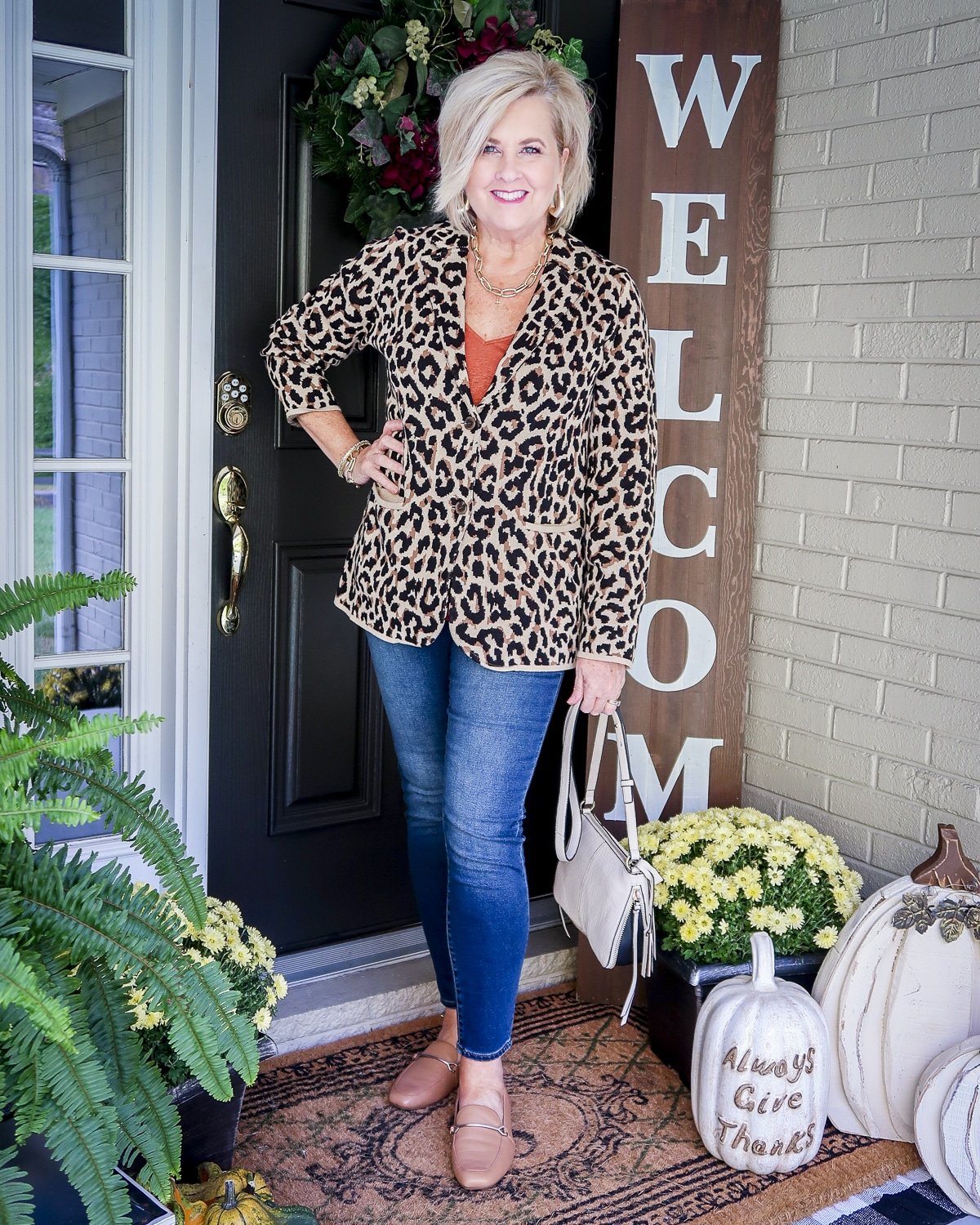 Fashion Blogger 50 Is Not Old is wearing a leopard sweater blazer with skinny jeans and a crossbody handbag