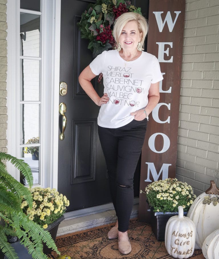 Fashion Blogger 50 Is Not Old is wearing a wine graphic t-shirt