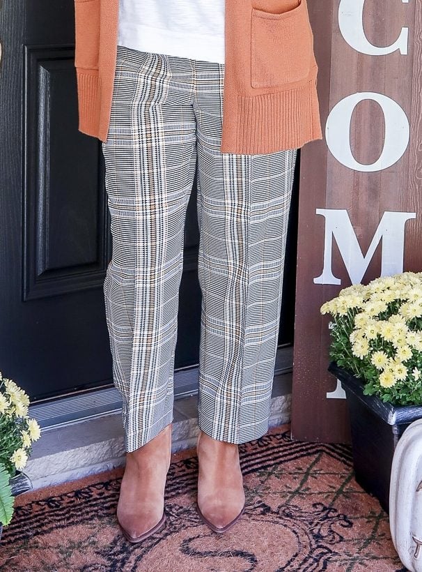 Fashion Blogger 50 Is Not Old is wearing plaid ankle pants and Sam Edelman ankle boots