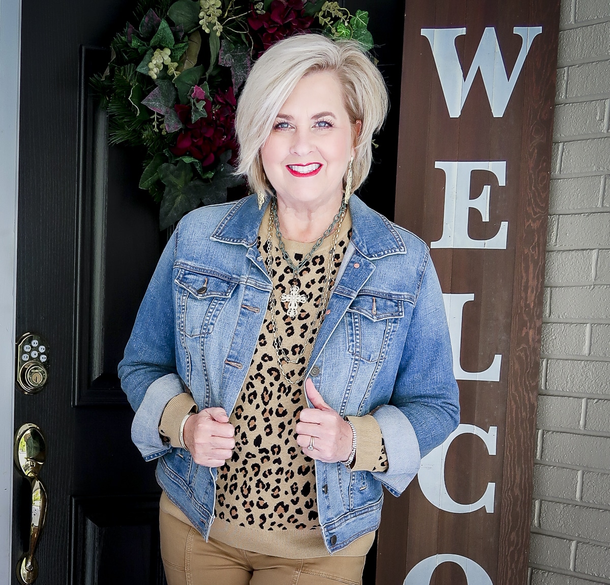 Fashion Blogger 50 Is Not Old is styling a leopard print sweater with a denim jacket