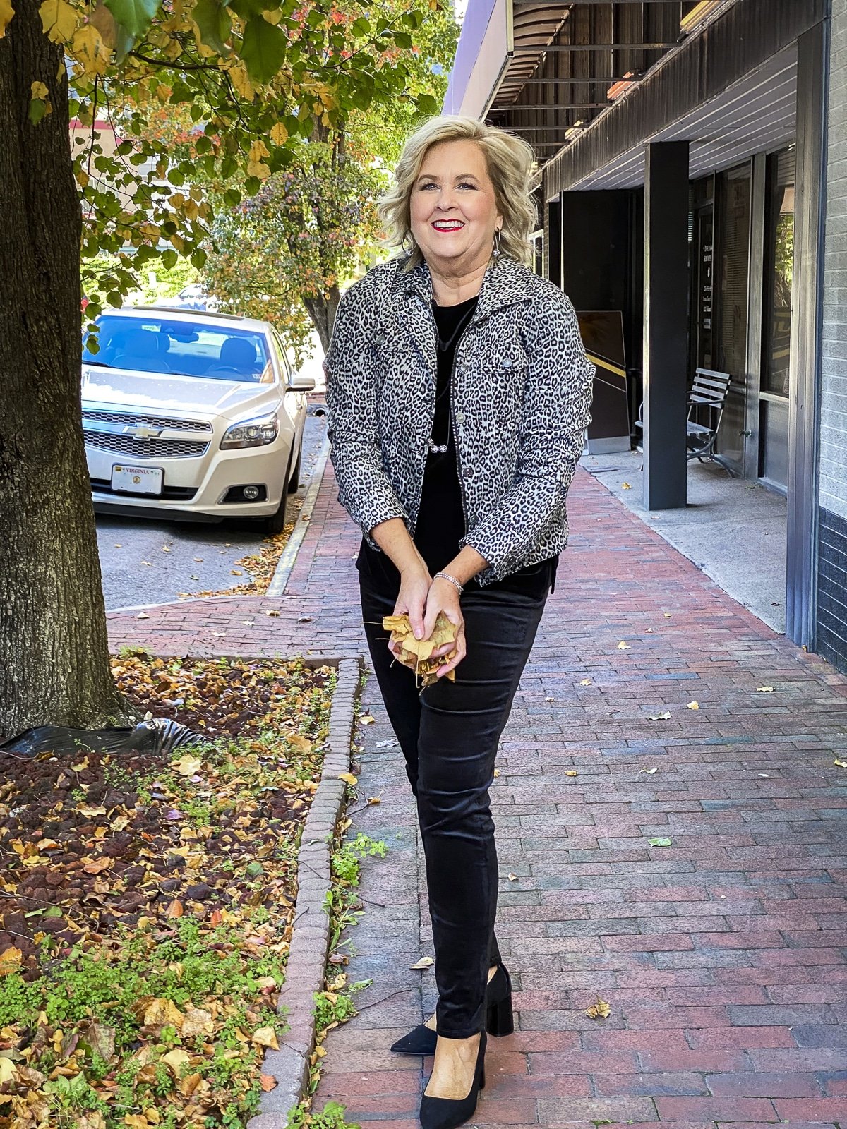 Fashion Blogger 50 Is Not Old is wearing a black velvet tank top, an animal print velveteen jacket, and black velvet jeggings from Chico's