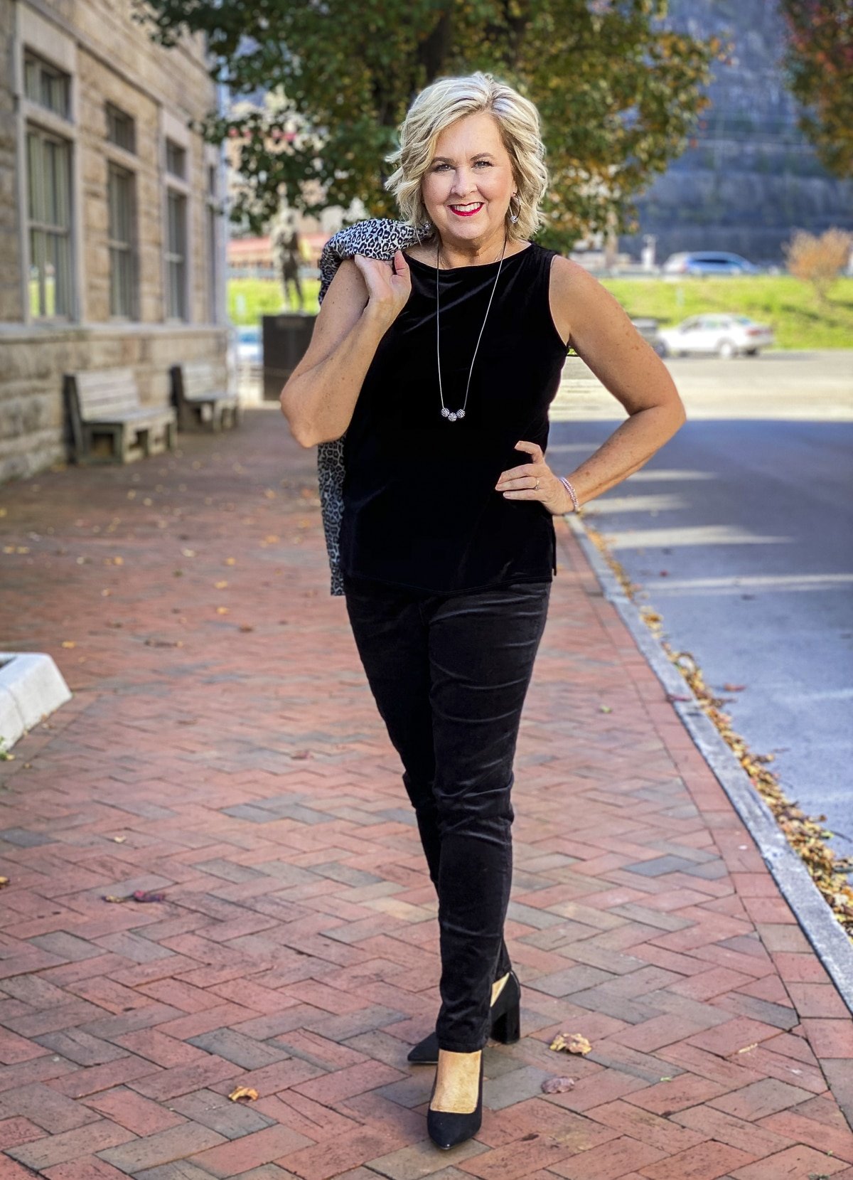 Fashion Blogger 50 Is Not Old is Holiday festive in a black velvet tank top and jeggings from Chico's