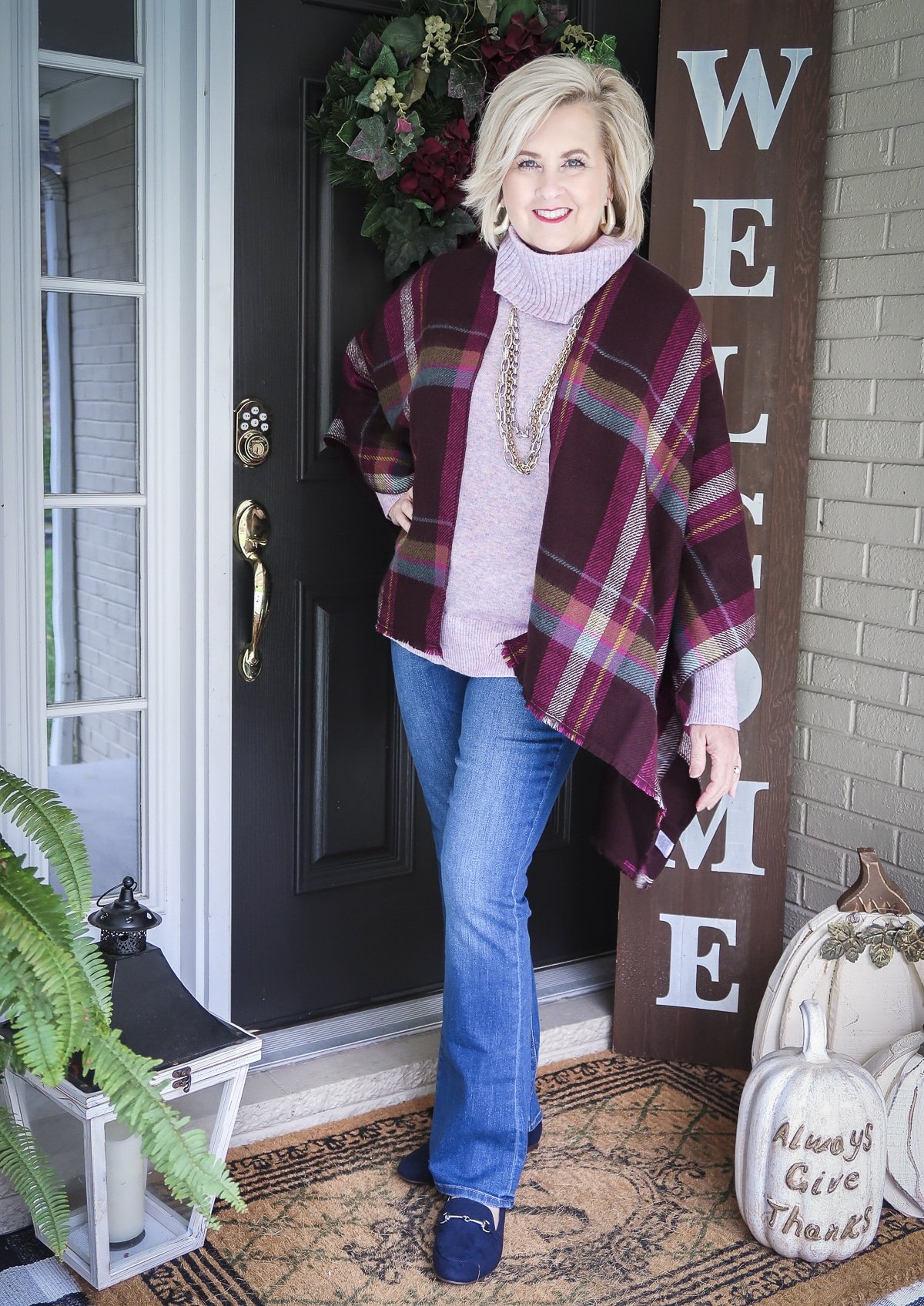 Fashion Blogger, 50 Is Not Old, is Thanksgiving ready with this colorful plaid wrap, lilac cowl neck sweater, and bootcut jeans