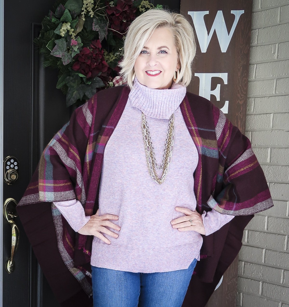 Fashion Blogger, 50 Is Not Old, is Thanksgiving ready with this colorful plaid wrap, lilac cowl neck sweater, and gold jewelry from Kendra Scott