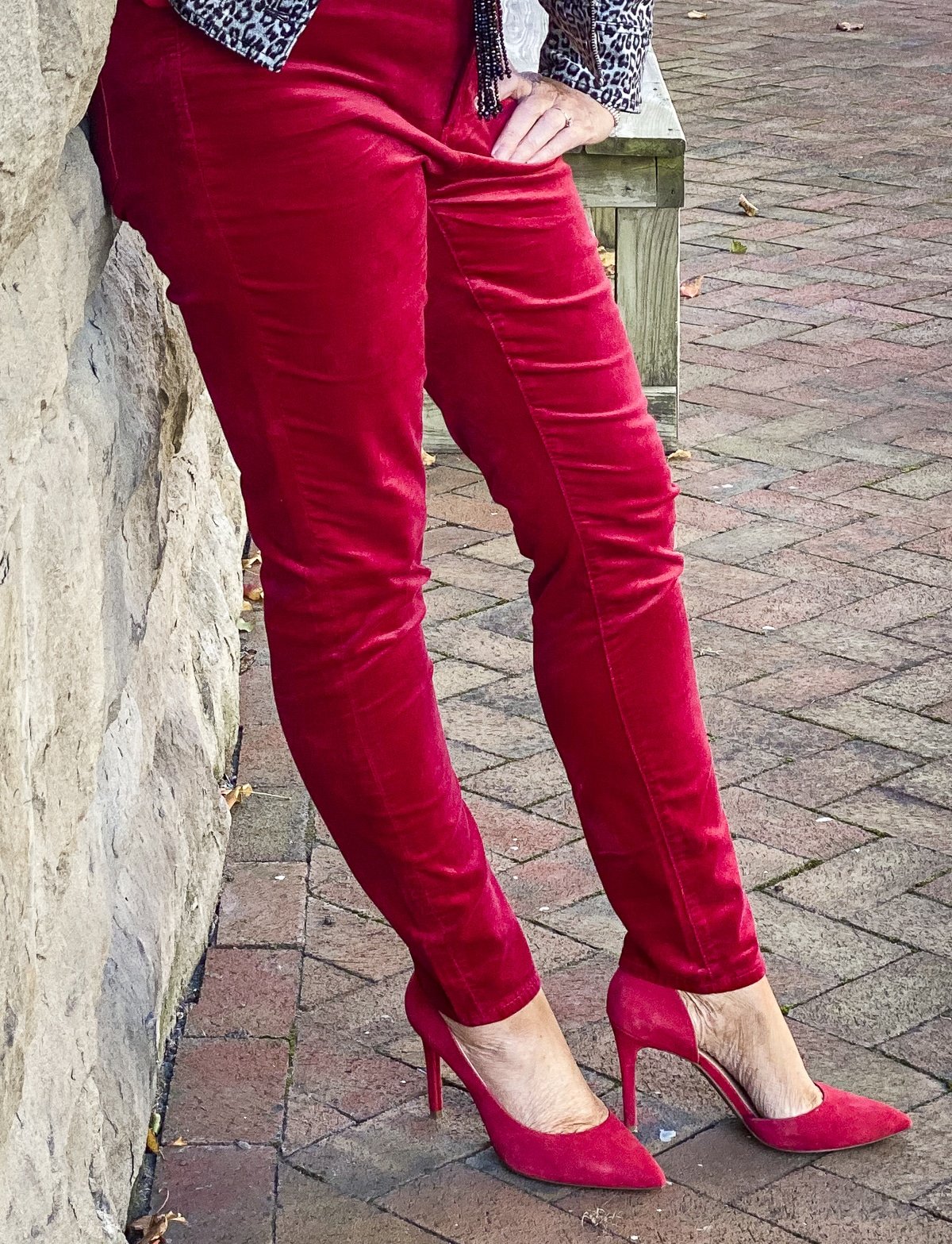 Fashion Blogger 50 Is Not Old is wearing a pair of red velvet jeans with red heels