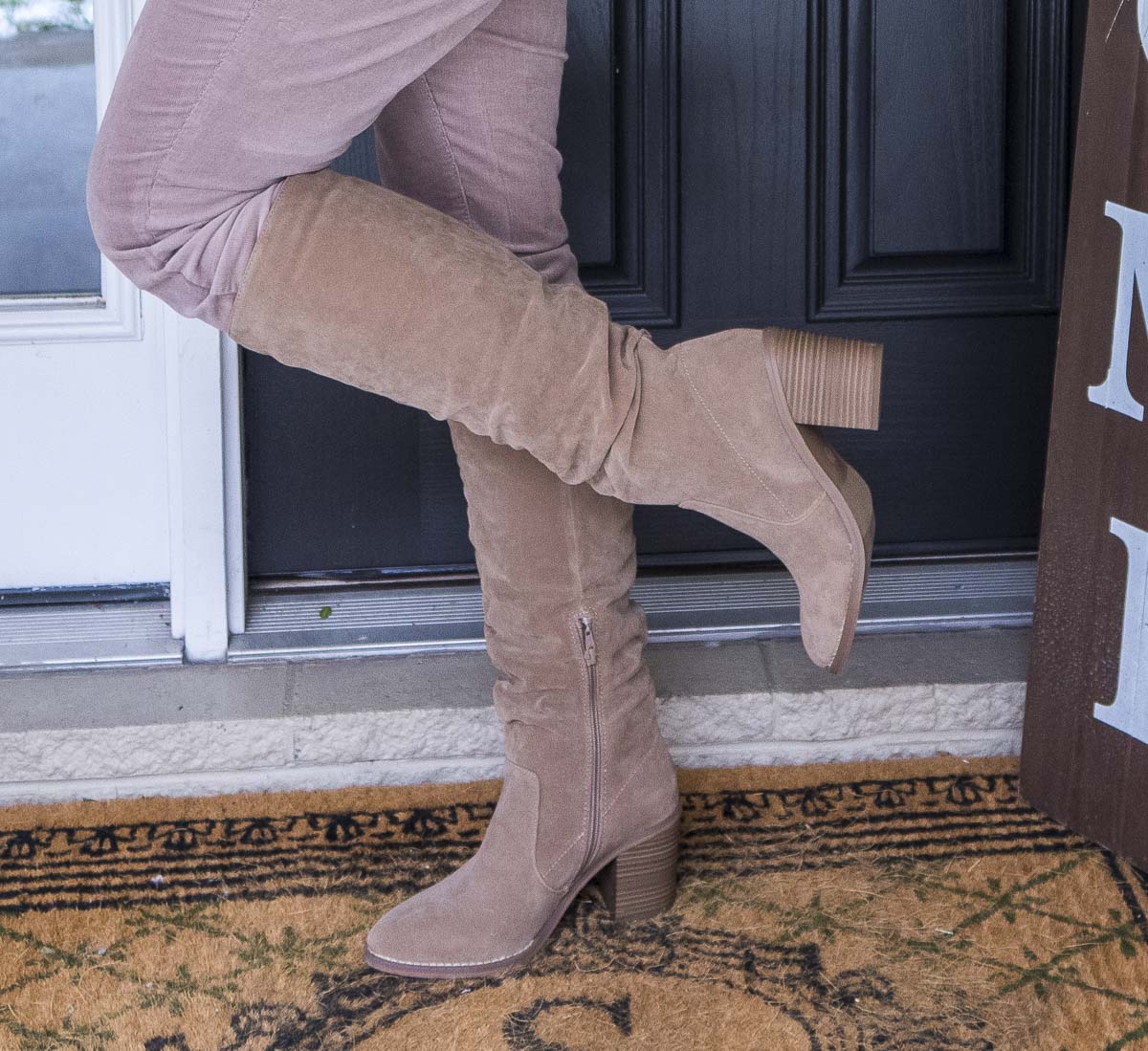 Fashion Blogger 50 Is Not Old is wearing a pair of scrunch knee boots from Target