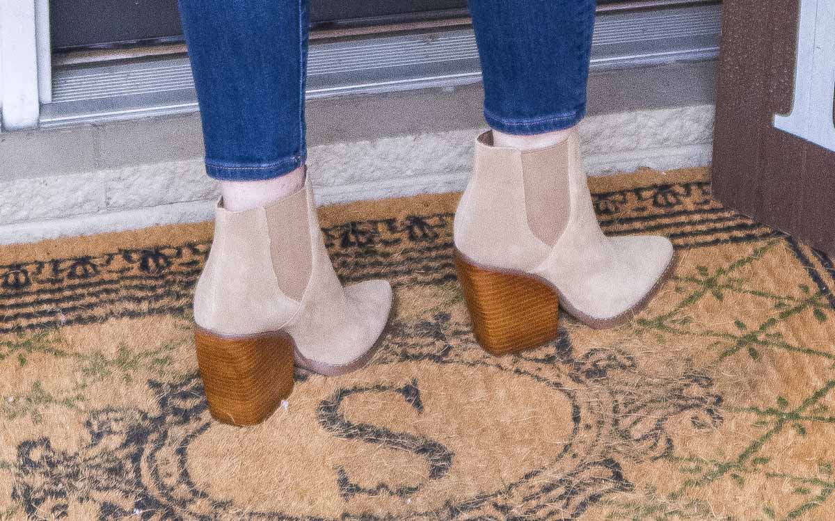 Fashion Blogger 50 Is Not Old is wearing neutral colored booties with chunky heels