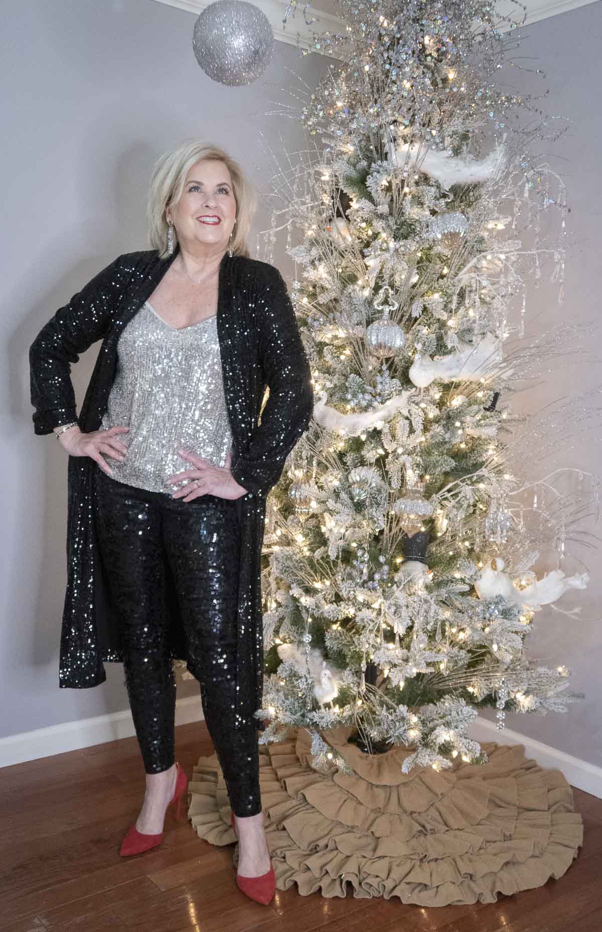 Fashion Blogger 50 Is Not Old is wearing a black sequined outfit to ring in the New Year